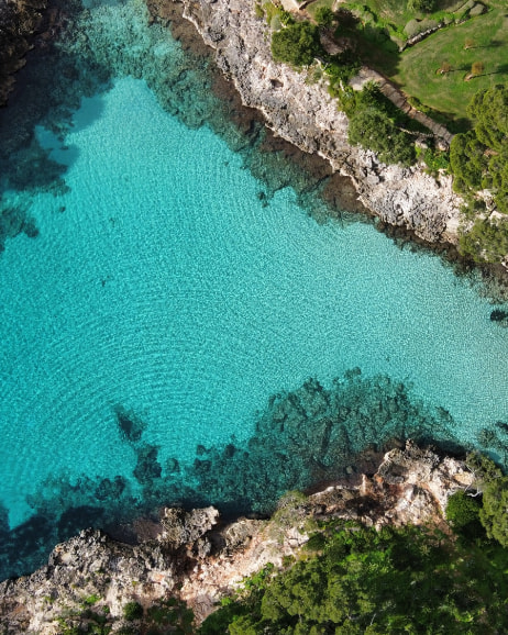 Aerial view of Cala Serena and its turquoise blue waters