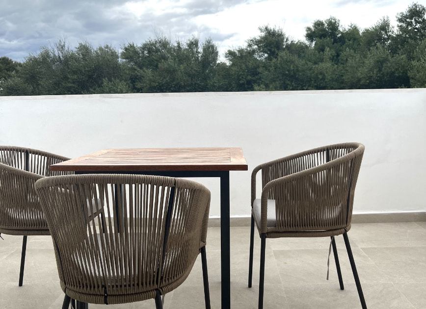 Terrace of the flat with outdoor table and chairs